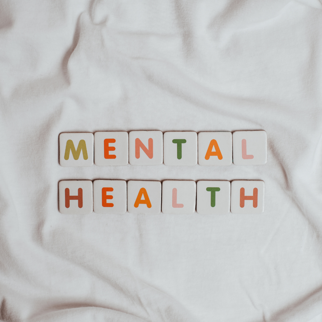 Photo of the word Mental Health spelt out on a white fabric